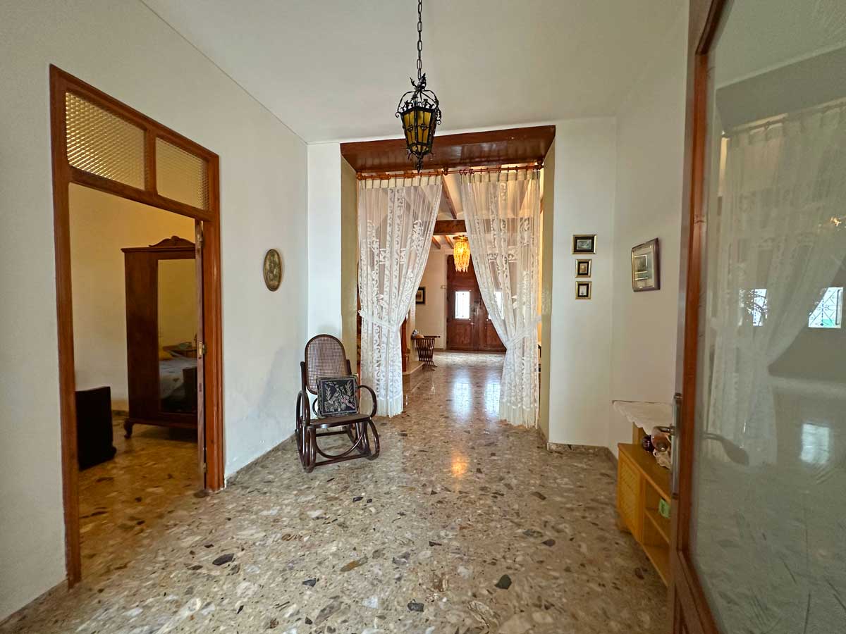 hall with door to downstairs bedroom